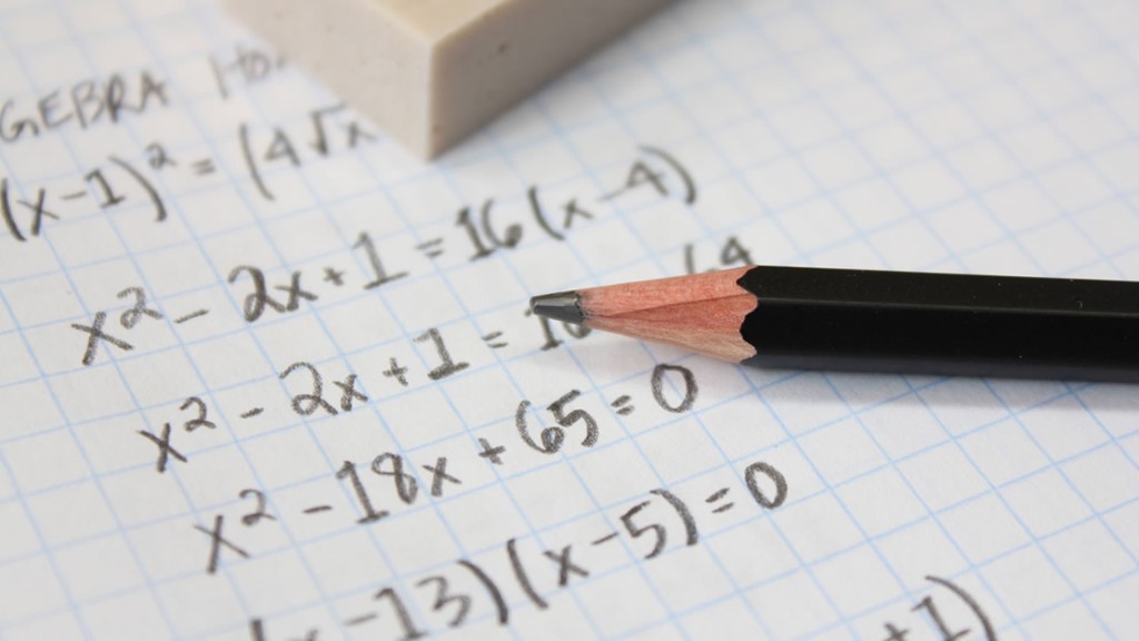 Handwritten algebra on graph paper with a pencil—representing the work of learning and problem-solving behind the interview insights.